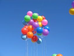 bunches of multicolored balloons at sky