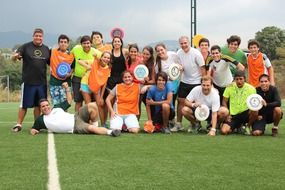 happy people posing together on lawn, venezuela, llanada ultimate game camp