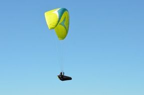 hang glider over blue sky