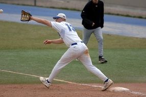 sportsman in white uniform in baseball