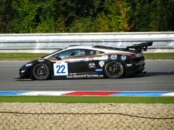 black sports automobile on the motorway