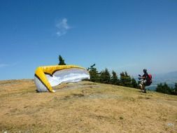 paragliding in the high mountains on a sunny day