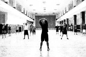 black and white photo of a workout in the gym