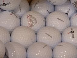 glossy white golf balls, background