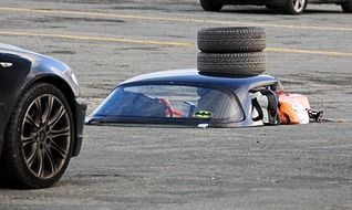 blue race car on the track