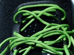 green shoelace for sports shoes close up