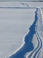 landscape of snow trail cross