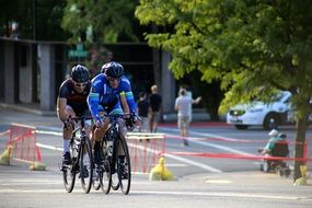 two racing cyclist on the road