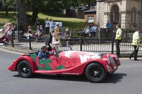 sports car on a city street on a sunny day