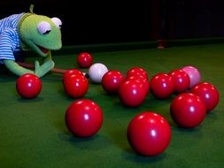 Toy frog with red balls