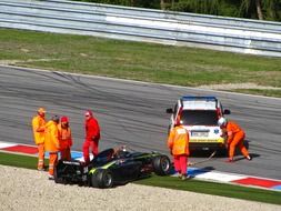 team near a racing car