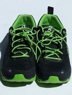 black sneakers with green laces