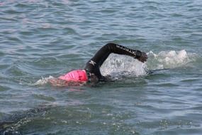 swimmer swims in water at speed