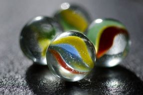 transparent balls with stripes on marble