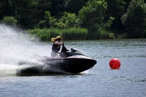 girl on a jet ski on a lake