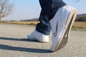 walking in Nike sneakers