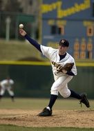 baseball player catches the ball with his hand