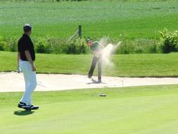 golf game on green field