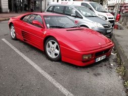 red ferrari in the parking lot