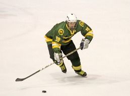 hockey player with hockey stick