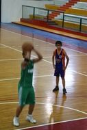 boys play basketball in the gym