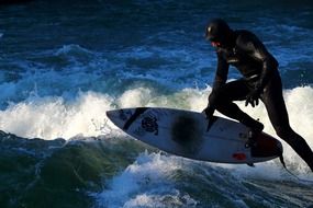 man jumping on a surfboard