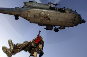 rise of a sailor in a helicopter