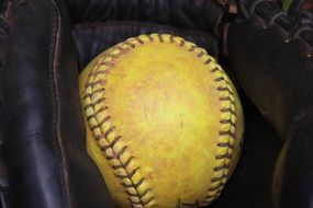 ball in glove for softball