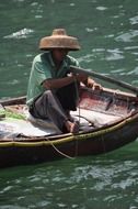 a man in a boat fishing