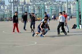 picture of the boys are playing basketball