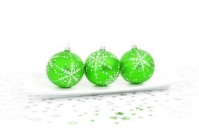 Three green Christmas balls