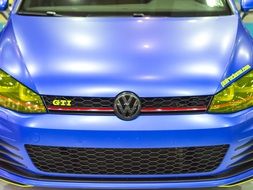 front of the bright Volkswagen
