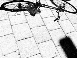 The shadow of a bicycle on the streets of Amsterdam