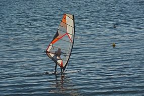 surfing with a sail in the ocean