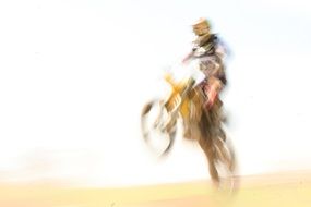 Jumping on the motocross in a blurred background
