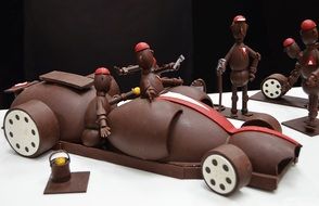 men and sports car made of chocolate