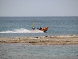 picture of the sailing motorboat on ocean