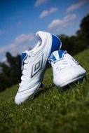 football boots on the grass