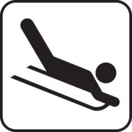 silhouette of a man on a sled