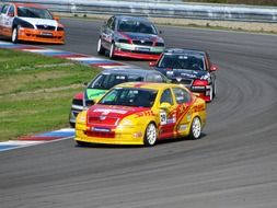 racing cars on the track in sports