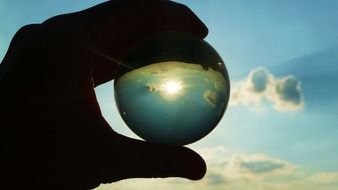 Glass ball in the hand