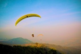 paragliding in a sunny haze