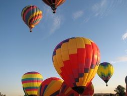 flight of colorful balloons in the sky