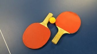 tennis rackets are on the table, ping pong