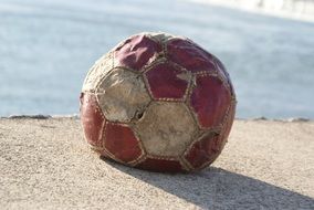 old leather worn out football ball