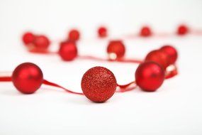 red christmas balls near red ribbon