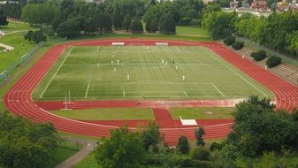 sports field with a football field and a treadmill
