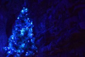 blue christmas tree with lights