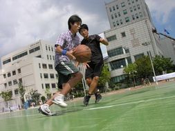 men play basketball