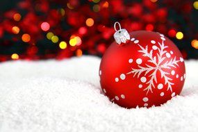 Christmas tree ball on snow
